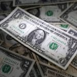 Dollar Gains As Fed Chief Signals Higher-For-Longer Rate Outlook