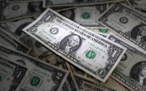 Dollar Gains As Fed Chief Signals Higher-For-Longer Rate Outlook